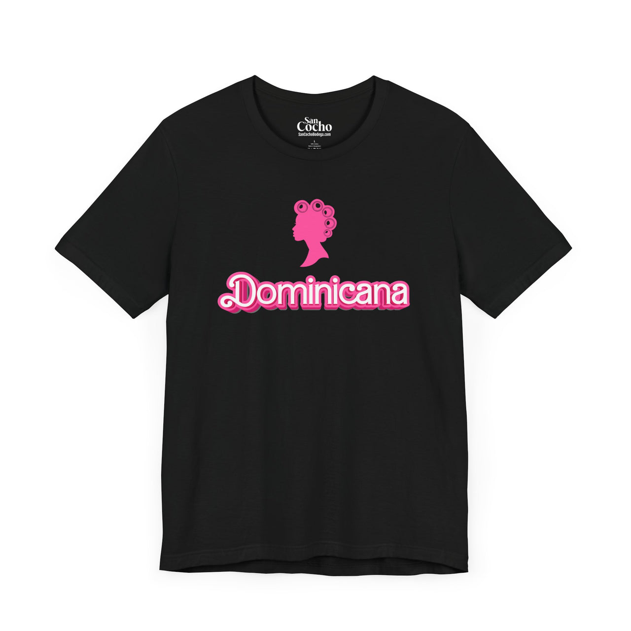 Black Bella + Canvas 3001  t-shirt with a bold pink Barbie Style Font with the word 'Dominicana' text across the chest, featuring a Barbie style silhouette of a woman's head in hair curlers above the text, designed in a vibrant and playful style.