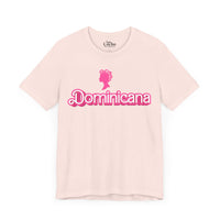 Thumbnail for Light Pink Bella + Canvas 3001  t-shirt with a bold pink Barbie Style Font with the word 'Dominicana' text across the chest, featuring a Barbie style silhouette of a woman's head in hair curlers above the text, designed in a vibrant and playful style.