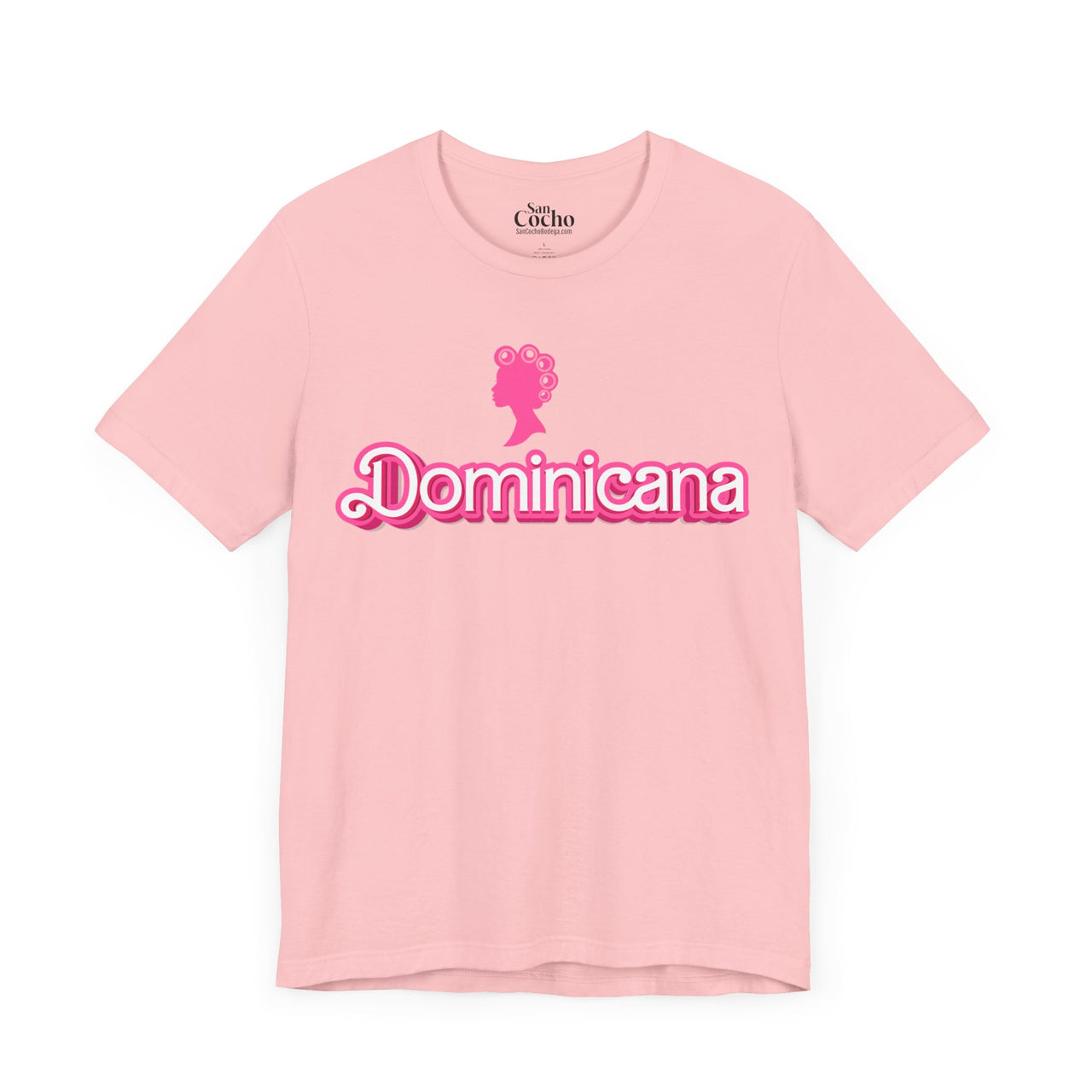 Bright Pink Bella + Canvas 3001  t-shirt with a bold pink Barbie Style Font with the word 'Dominicana' text across the chest, featuring a Barbie style silhouette of a woman's head in hair curlers above the text, designed in a vibrant and playful style.