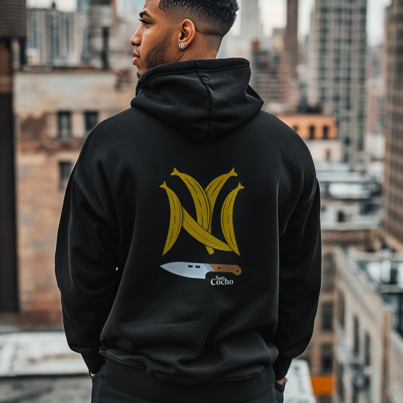 Back of a good Looking Dominican Uncle, Papi or Dad Wearing a Gildan 18500 graphic hoodie with Platanos Shaped Like the New York Yankees Logo and "SanCocho Bodega" Text on the back