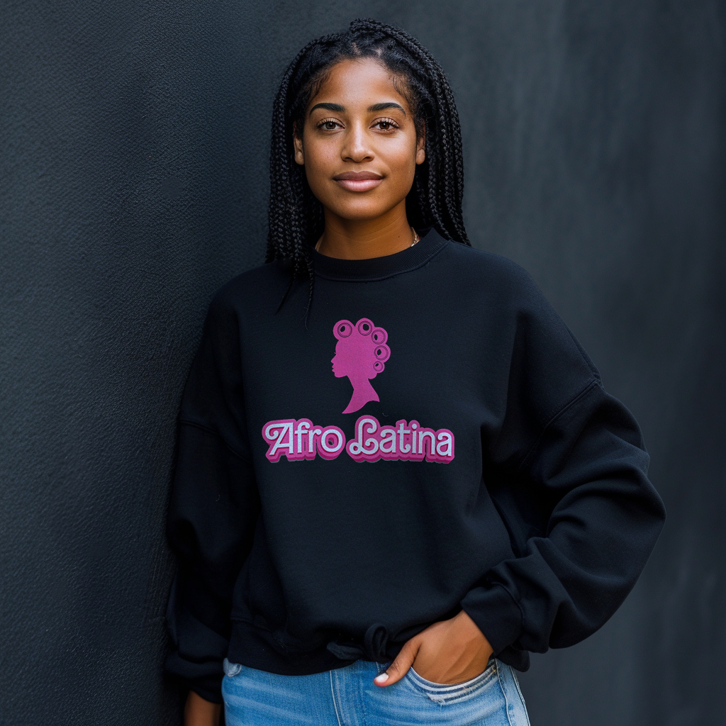 Beautiful Dominican girl smiling wearing an oversized Gildan 18000 graphic crew neck sweatshirt with a Barbie con Rollos graphic and the words "Afro Latina" on the front