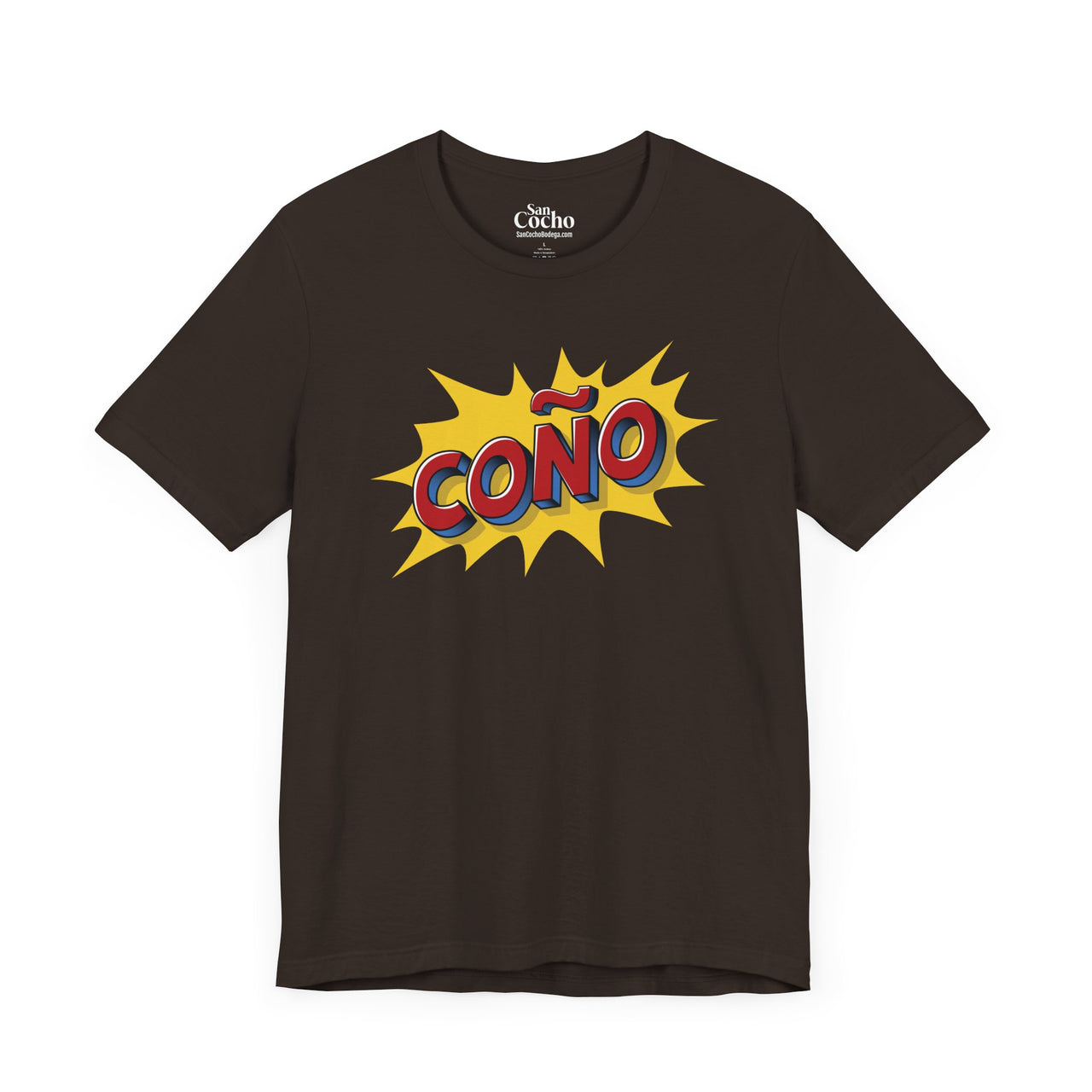 A brown flat lay mockup of a graphic Bella Canvas 3001 graphic tshirt in comic book style with the words "Coño" on the front