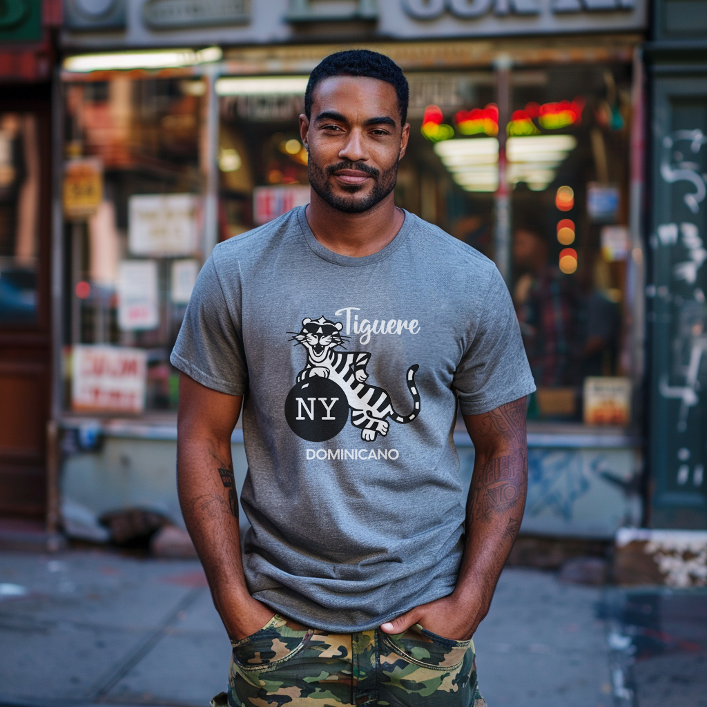 Good looking Dominican papi wearing a Bella Canvas 3001 graphic tshirt with a cartoon tiger and a bomb with the words "Tiguere NY Dominicano" on the front