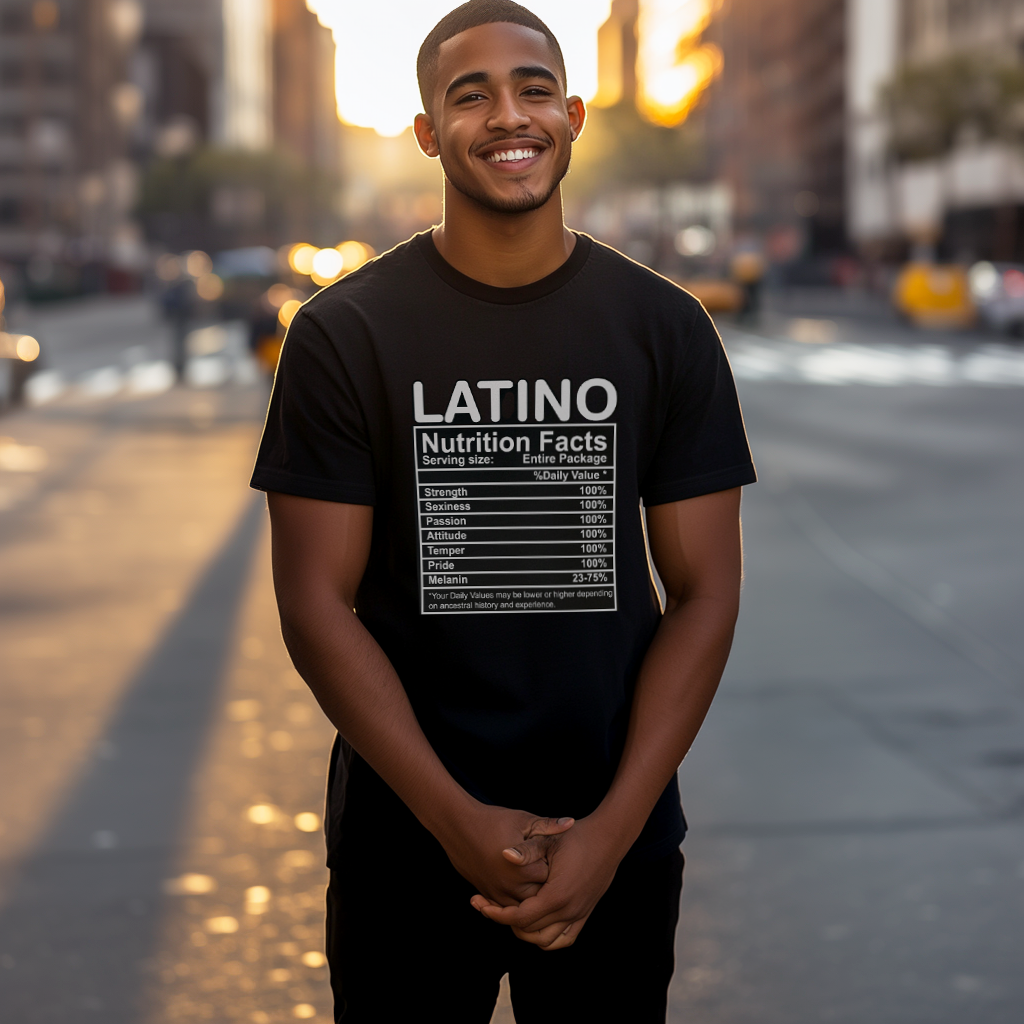 Handsome Dominican papi smiling wearing an oversized Bella Canvas 3001 graphic tshirt with the words "Latino Nutrition Facts" followed by an ingredients label on the front