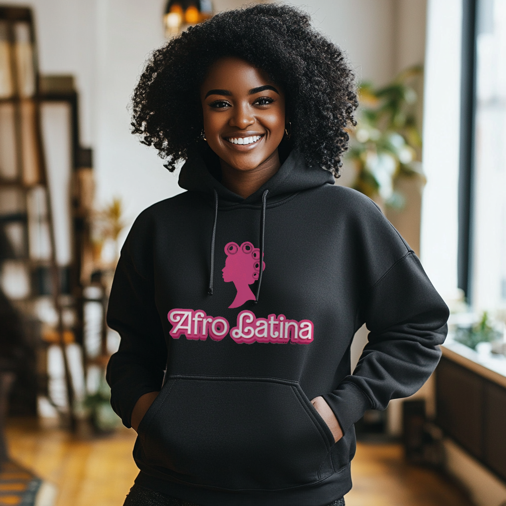 Pretty Dominican girl smiling wearing an oversized Gildan 18500 graphic hoodie with a Barbie con Rollos graphic and the words "Afro Latina" on the front