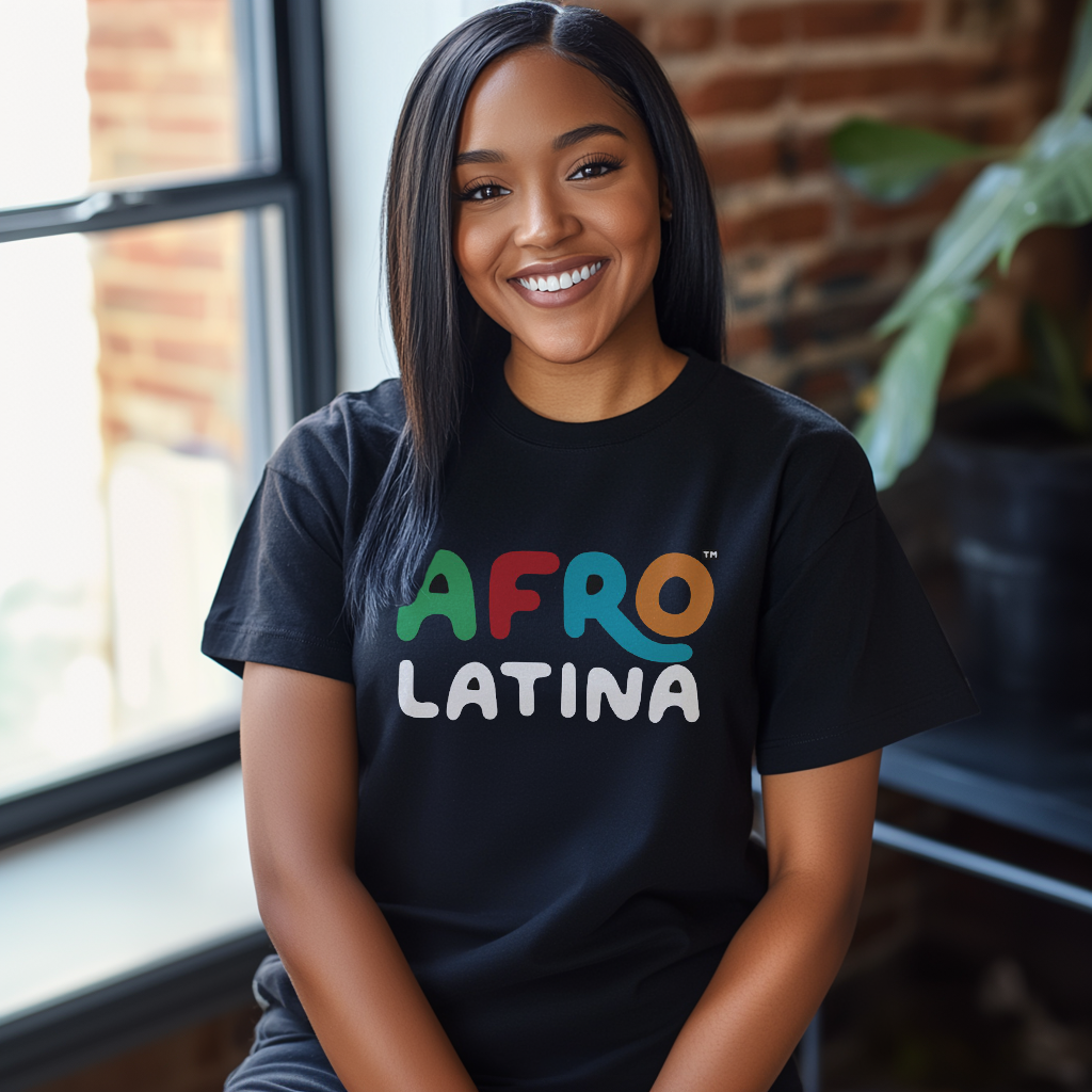 Pretty Dominican girl smiling wearing an oversized Bella Canvas 3001 graphic tshirt with the words "Afro Latina" on the front