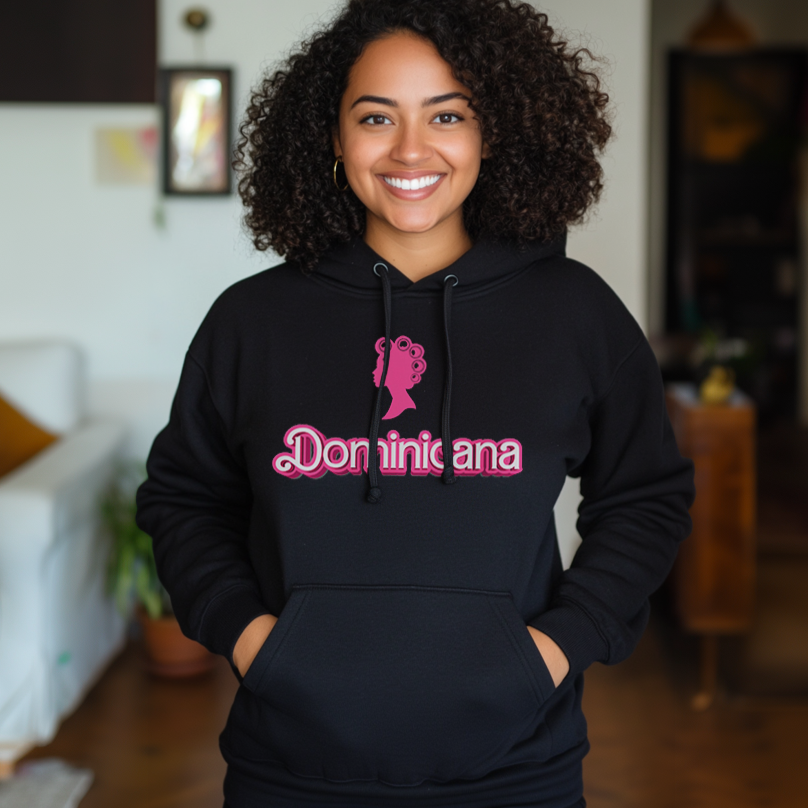 Pretty Dominican girl smiling wearing an oversized Gildan 18500 graphic hoodie with a Barbie con Rollos graphic and the words "Doninicana" on the front