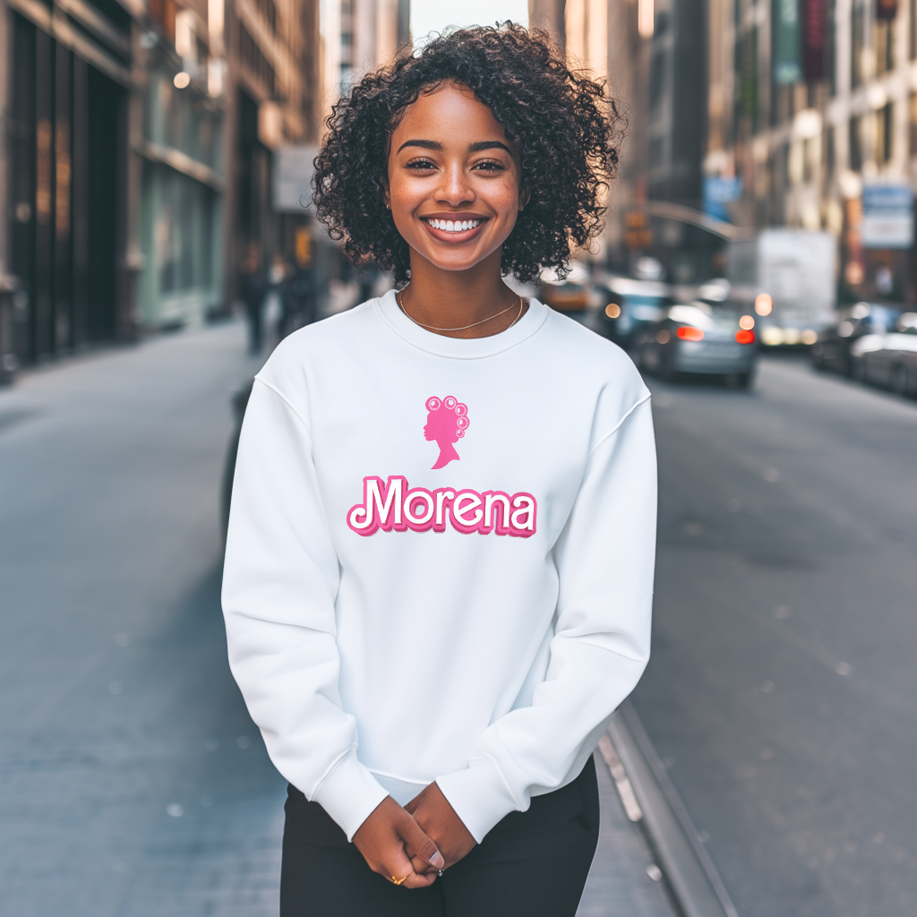 Pretty Dominican girl smiling wearing a Gildan 18000 graphic crew neck sweatshirt with a Barbie con Rollos graphic and the words "Morena" on the front