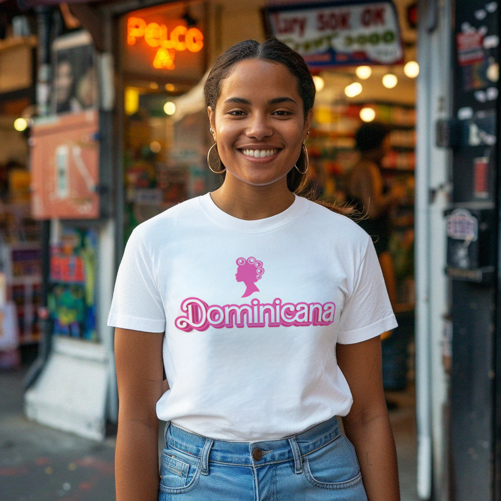 Beautiful Dominican girl smiling wearing an oversized Bella Canvas 3001 graphic tshirt with a Barbie con Rollos graphic and the words "Dominicana" on it